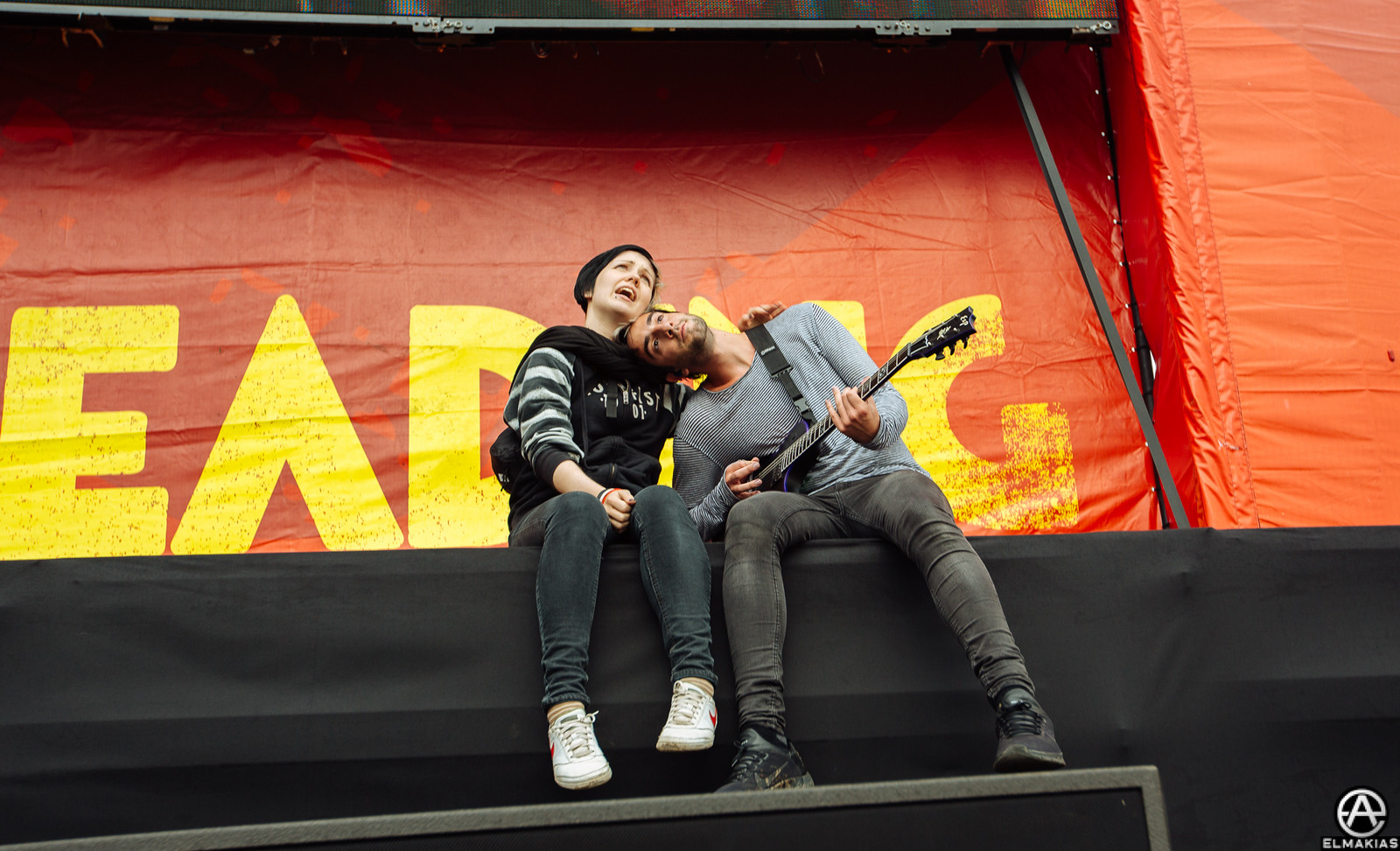Jack Barakat and fan hanging on stage at Reading Festival 2015 by Adam Elmakias